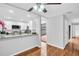 The kitchen has stainless steel appliances and granite countertops at 714 1St Ct, Palm Harbor, FL 34684
