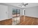 Living room with ceramic tile floors and sliding doors leading to the patio at 714 1St Ct, Palm Harbor, FL 34684