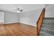 Spacious living room features ceramic tile and staircase at 714 1St Ct, Palm Harbor, FL 34684