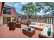 Relaxing outdoor patio features a comfortable seating area with elegant wicker furniture at 714 1St Ct, Palm Harbor, FL 34684