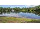 Community pond with fountain provides a serene and tranquil view at 714 1St Ct, Palm Harbor, FL 34684