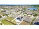 Neighborhood aerial showcasing the property's solar panels and proximity to community amenities at 7305 Tiger Trail Ct, Sun City Center, FL 33573