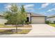 Single-story home with a well-manicured lawn and a spacious two-car garage at 7305 Tiger Trail Ct, Sun City Center, FL 33573