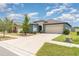 Charming single Gathering home with a well-manicured lawn and a two-car garage at 7305 Tiger Trail Ct, Sun City Center, FL 33573