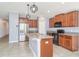 Beautiful open kitchen with stainless steel appliances and center island with granite countertops at 7305 Tiger Trail Ct, Sun City Center, FL 33573