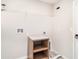 A laundry room featuring a wire shelf, cabinet, and hook-ups ready for installation at 7305 Tiger Trail Ct, Sun City Center, FL 33573