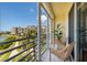 Balcony with seating offers a relaxing outdoor space and views of nearby condos at 7872 Sailboat Key S Blvd # 301, South Pasadena, FL 33707