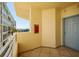 Balcony featuring an exterior wall view of the waterfront, an apartment building, and a blue doorway at 7872 Sailboat Key S Blvd # 301, South Pasadena, FL 33707