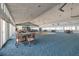 Bright, spacious event space with high ceilings, dance floor, ceiling fans, and seating arrangements at 7872 Sailboat Key S Blvd # 301, South Pasadena, FL 33707