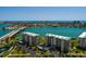 Scenic aerial view of waterfront condos with access to tranquil blue waters and city views at 7872 Sailboat Key S Blvd # 301, South Pasadena, FL 33707