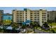 Beautiful exterior of waterfront condos with well-maintained landscaping and partial water views at 7872 Sailboat Key S Blvd # 301, South Pasadena, FL 33707