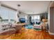Open concept living area with water views, modern furnishings, and hardwood floors at 7872 Sailboat Key S Blvd # 301, South Pasadena, FL 33707