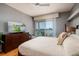 Well-lit main bedroom with hardwood floors and sliding doors that lead to a private balcony at 7872 Sailboat Key S Blvd # 301, South Pasadena, FL 33707