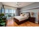 Bright main bedroom featuring stylish furnishings, light walls, and access to a private balcony at 7872 Sailboat Key S Blvd # 301, South Pasadena, FL 33707