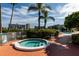 Relaxing spa with clear water, steps for easy access, and tropical landscaping nearby at 7872 Sailboat Key S Blvd # 301, South Pasadena, FL 33707