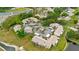 Aerial view of condo community showing multiple units, parking, and landscaping at 7910 Hardwick Dr # 717, New Port Richey, FL 34653