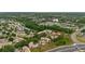 Aerial view of community with lake, pool, and roadways at 7910 Hardwick Dr # 717, New Port Richey, FL 34653