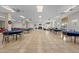Large community room with tiled floor, fans, large windows, and tables and chairs at 7910 Hardwick Dr # 717, New Port Richey, FL 34653