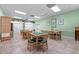 Game room with tables and chairs, a ceiling fan and built in storage at 7910 Hardwick Dr # 717, New Port Richey, FL 34653