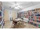 Cozy library with ceiling fan, filled with books and equipped with tables and chairs at 7910 Hardwick Dr # 717, New Port Richey, FL 34653