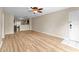 Inviting living room with wood-look floors and an open floor plan connecting to the kitchen at 7910 Hardwick Dr # 717, New Port Richey, FL 34653