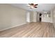 Spacious living room features modern ceiling fan and stylish flooring extending into the kitchen area at 7910 Hardwick Dr # 717, New Port Richey, FL 34653