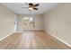 Bright living room with durable flooring, ceiling fan, and large window offering plenty of natural light at 7910 Hardwick Dr # 717, New Port Richey, FL 34653