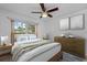 Stylishly furnished main bedroom with wood floors, natural light, and serene decor at 7910 Hardwick Dr # 717, New Port Richey, FL 34653