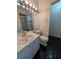 Bathroom with a white vanity, toilet, and shower with tiled walls at 8114 Oak Trace Way # D, Tampa, FL 33634