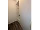 Bathroom with door ajar revealing the tub with shower, along with wood-style flooring at 8114 Oak Trace Way # D, Tampa, FL 33634