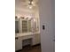 Bathroom featuring a double sink vanity with a full width mirror and ample cabinet space at 8114 Oak Trace Way # D, Tampa, FL 33634