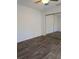Bedroom with mirrored closet doors and wood-style floors, creating a bright and spacious feel at 8114 Oak Trace Way # D, Tampa, FL 33634