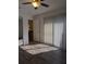 Bright bedroom with wood floors, large window, and a door that leads to other rooms at 8114 Oak Trace Way # D, Tampa, FL 33634