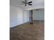 Large bedroom features wood-look floors, ceiling fan, and mirrored closet doors at 8114 Oak Trace Way # D, Tampa, FL 33634