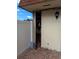 Exterior of the house with a storage shed, red brick patio, and a white fence at 8114 Oak Trace Way # D, Tampa, FL 33634