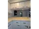 The kitchen area includes a breakfast bar and upper cabinets for storage at 8114 Oak Trace Way # D, Tampa, FL 33634