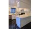 A bright kitchen featuring white cabinets and black tile floors at 8114 Oak Trace Way # D, Tampa, FL 33634