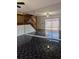 Living room with a black marble floor, mirrored wall, and staircase at 8114 Oak Trace Way # D, Tampa, FL 33634