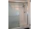 Bathroom shower with white tile and a glass enclosure at 8114 Oak Trace Way # D, Tampa, FL 33634