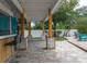 Spacious outdoor backyard patio with outdoor bar seating and room for lounging at 854 77Th N Ave, St Petersburg, FL 33702