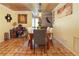 View of the dining room with a rustic table and chairs and decorative artwork at 854 77Th N Ave, St Petersburg, FL 33702