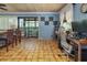 Living area with tile floors featuring access to the outdoor porch and desk with chair at 854 77Th N Ave, St Petersburg, FL 33702