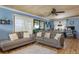 Bright living room with tile flooring, comfortable sofas, and sliding glass doors to the outdoors at 854 77Th N Ave, St Petersburg, FL 33702