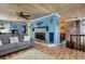 Cozy living room with brick fireplace, wood ceiling, and comfortable seating area at 854 77Th N Ave, St Petersburg, FL 33702