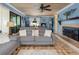 Inviting living room featuring a brick fireplace, tile flooring, and comfortable seating, perfect for relaxation at 854 77Th N Ave, St Petersburg, FL 33702