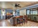 Spacious living room with wet bar, tiled floors, and a view of the sunroom, creating a cozy atmosphere at 854 77Th N Ave, St Petersburg, FL 33702
