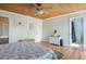 Spacious main bedroom with wood-paneled ceiling, modern furnishings, and an ensuite bathroom at 854 77Th N Ave, St Petersburg, FL 33702