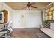Bright office space featuring wood floors, a built-in closet, and a comfortable seating area at 854 77Th N Ave, St Petersburg, FL 33702