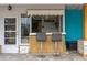 Outdoor bar and serving area with stools at 854 77Th N Ave, St Petersburg, FL 33702