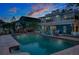 Inviting backyard with a pool, patio seating, and an outdoor kitchen perfect for relaxing and entertaining guests at 854 77Th N Ave, St Petersburg, FL 33702